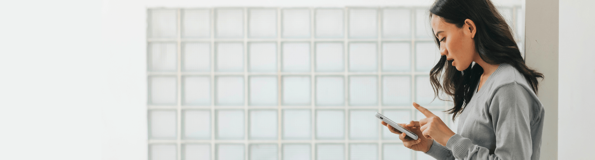 Woman looking down at her phone