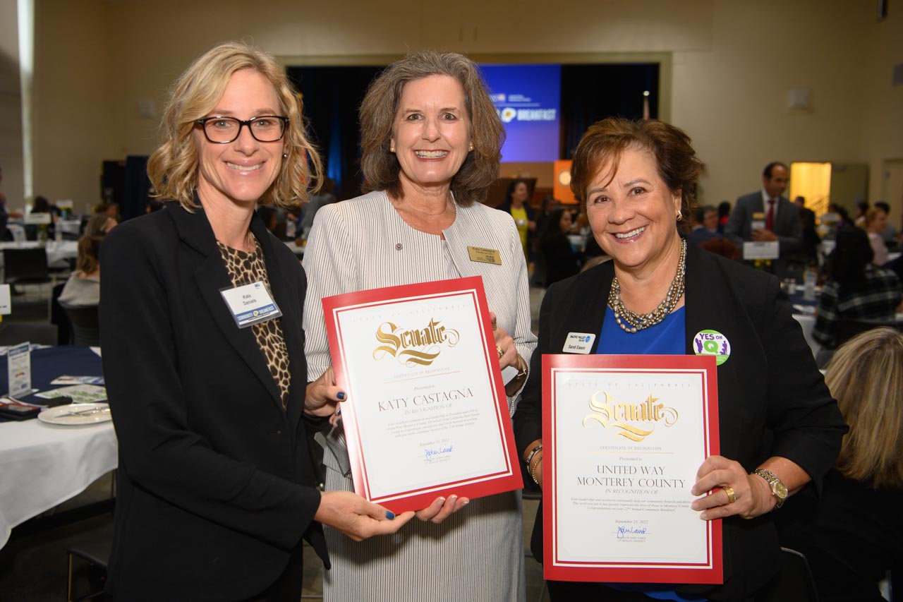 Katy and two attendees holding certificates