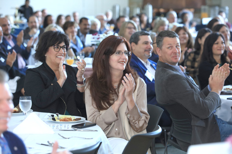 Community Breakfast crowd clapping