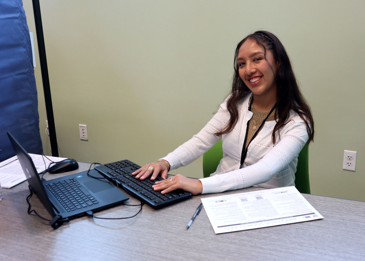 VITA Volunteer working on laptop