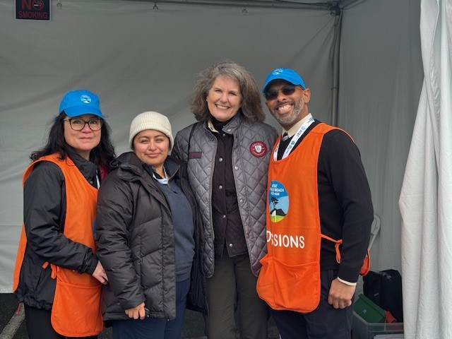 Two volunteers and two UWMC staff members