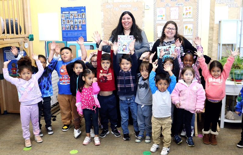 Two volunteers with group of children