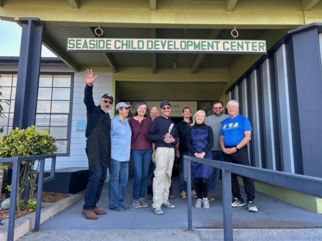 Group of volunteers standing in front of the Seaside Development Center